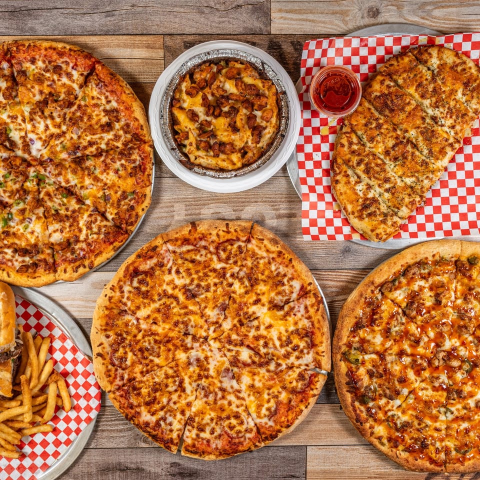 Pizza, pasta, and cheesy bread spread